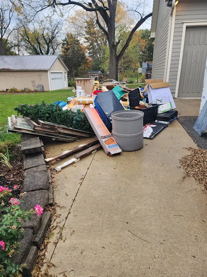Dumpster being loaded with debris for Roofing Dumpster Rental in Sylvania